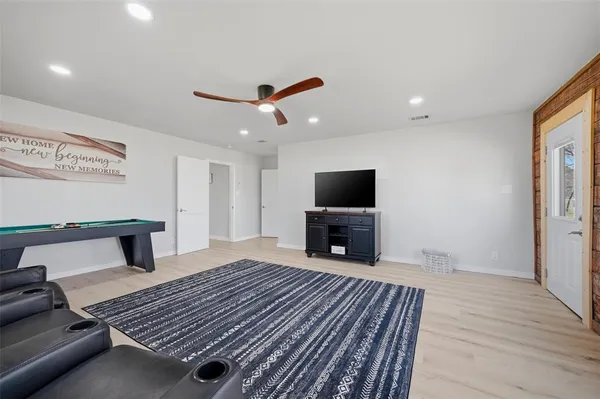 a living room with furniture rug and window
