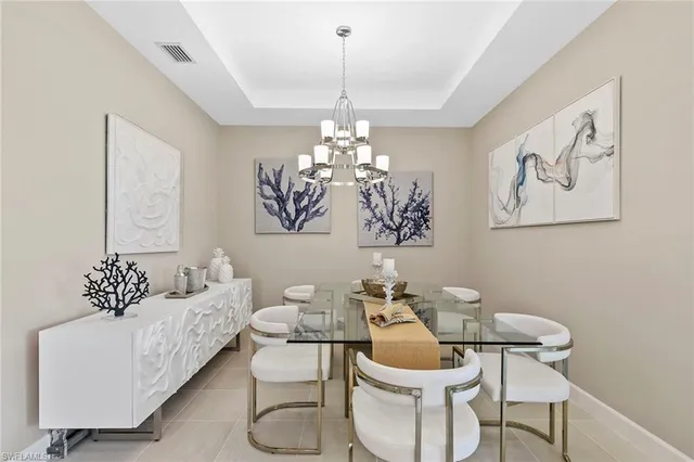 a bedroom with bed and a large window