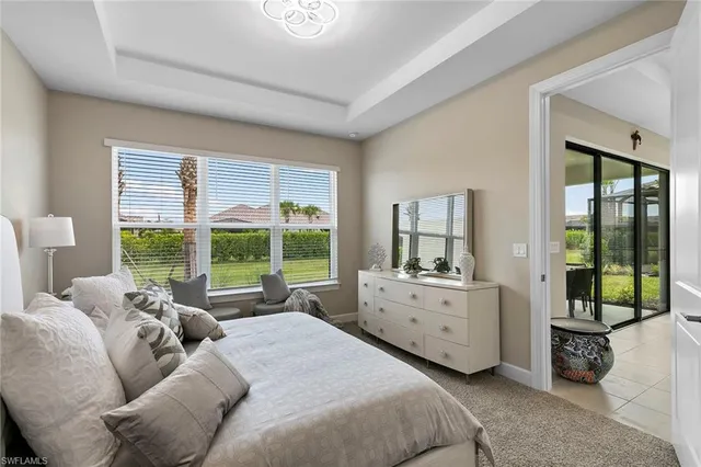 a spacious bathroom with a double vanity sink a mirror and shower