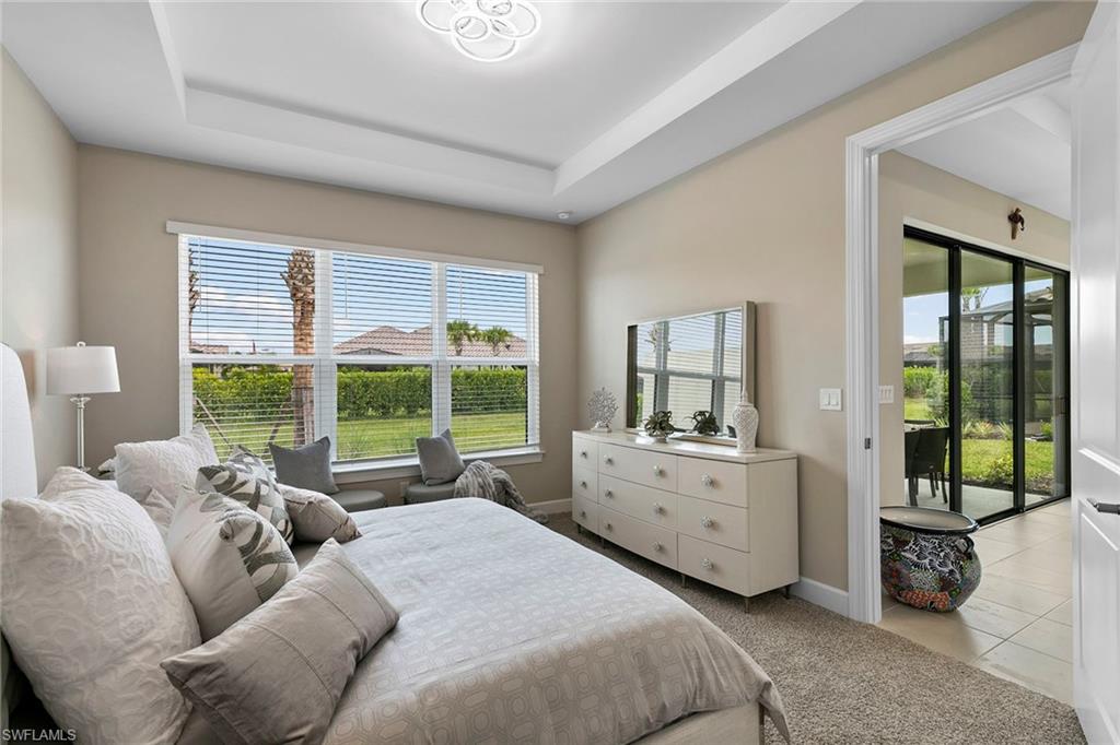 15189 Sacile Court Naples, FL 34114 - Photo 15 of 30 a bed room with a bed and a large window