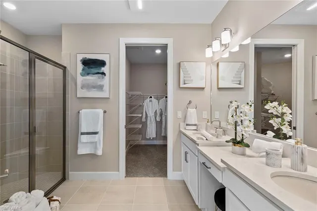 a view of walk in closet and bathroom