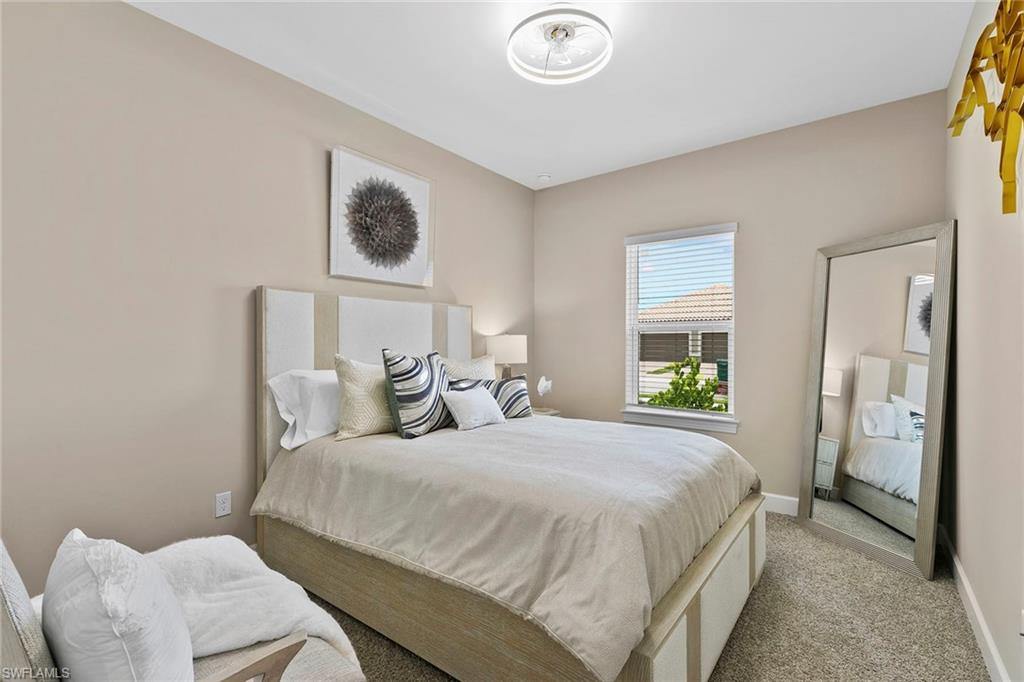 15189 Sacile Court Naples, FL 34114 - Photo 22 of 30 a bedroom with a bed and a window