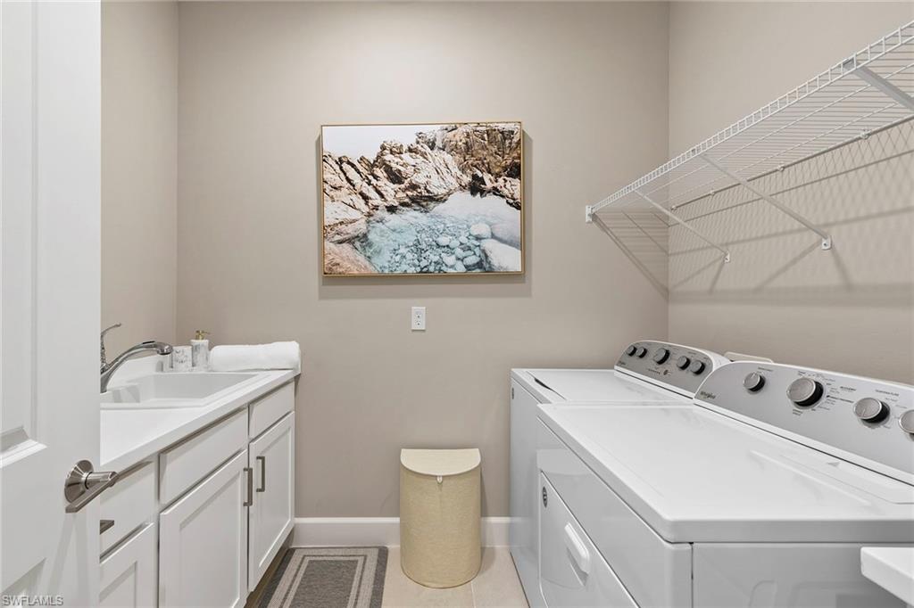 15189 Sacile Court Naples, FL 34114 - Photo 23 of 30 a bathroom with a sink toilet and mirror