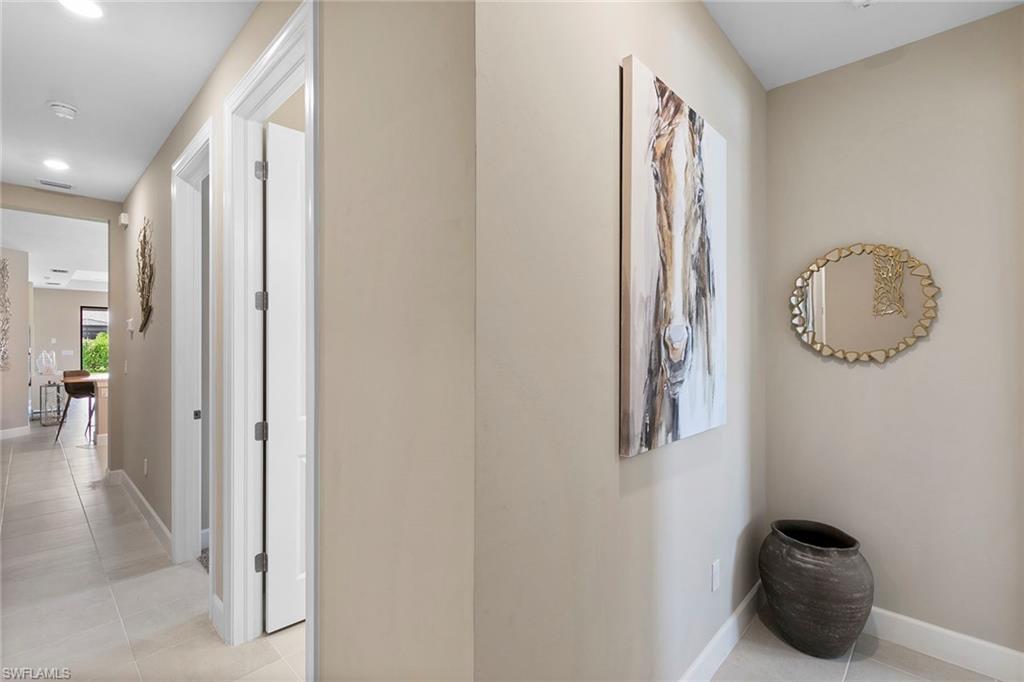 15189 Sacile Court Naples, FL 34114 - Photo 24 of 30 a view of a hallway with elevator