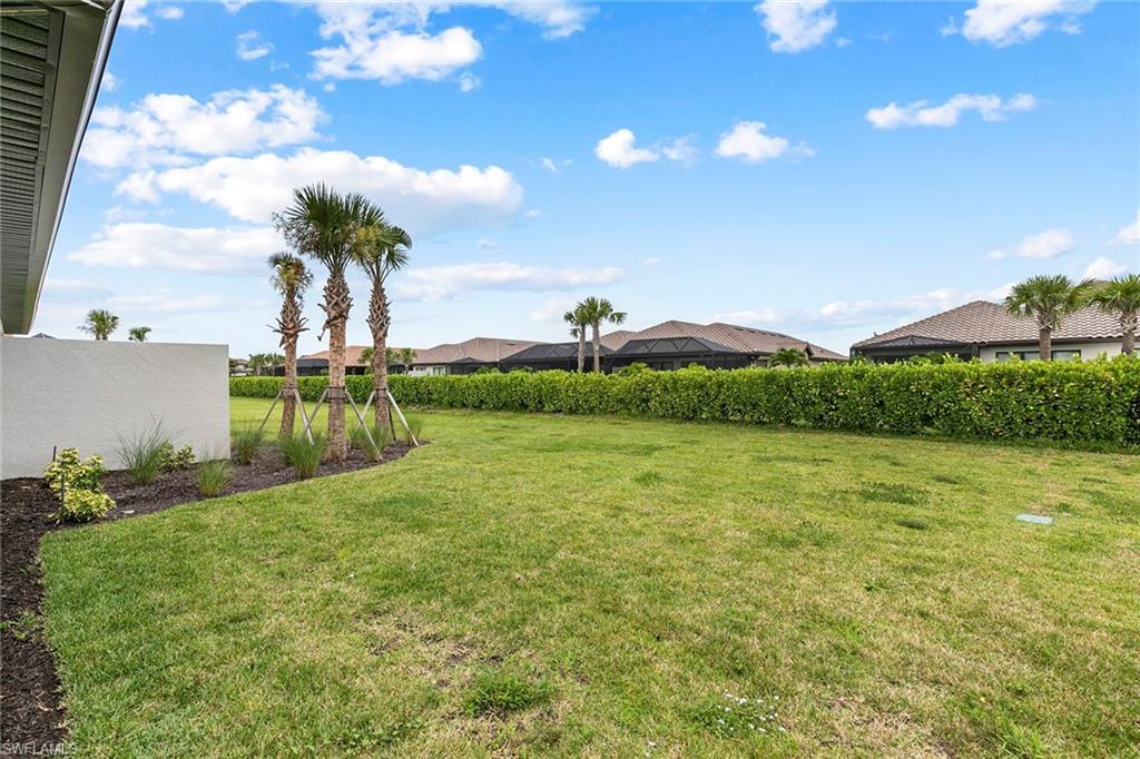 15189 Sacile Court Naples, FL 34114 - Photo 26 of 30 a view of a garden