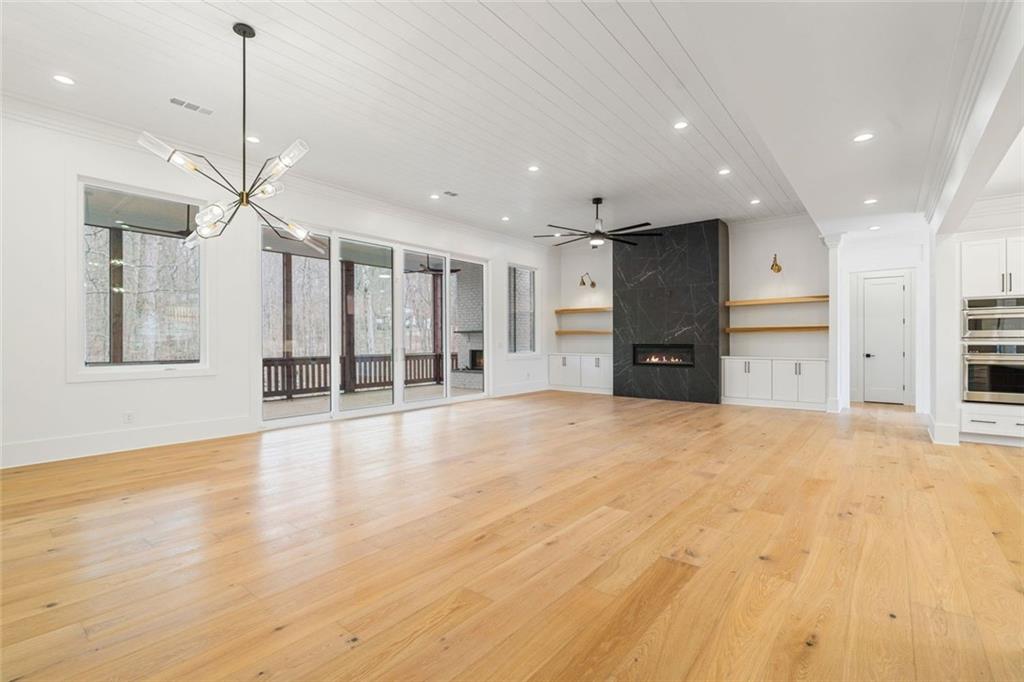 555 Lower Birmingham Road Canton, GA 30115 - Photo 58 of 104 a view of an empty room with a window and kitchen view