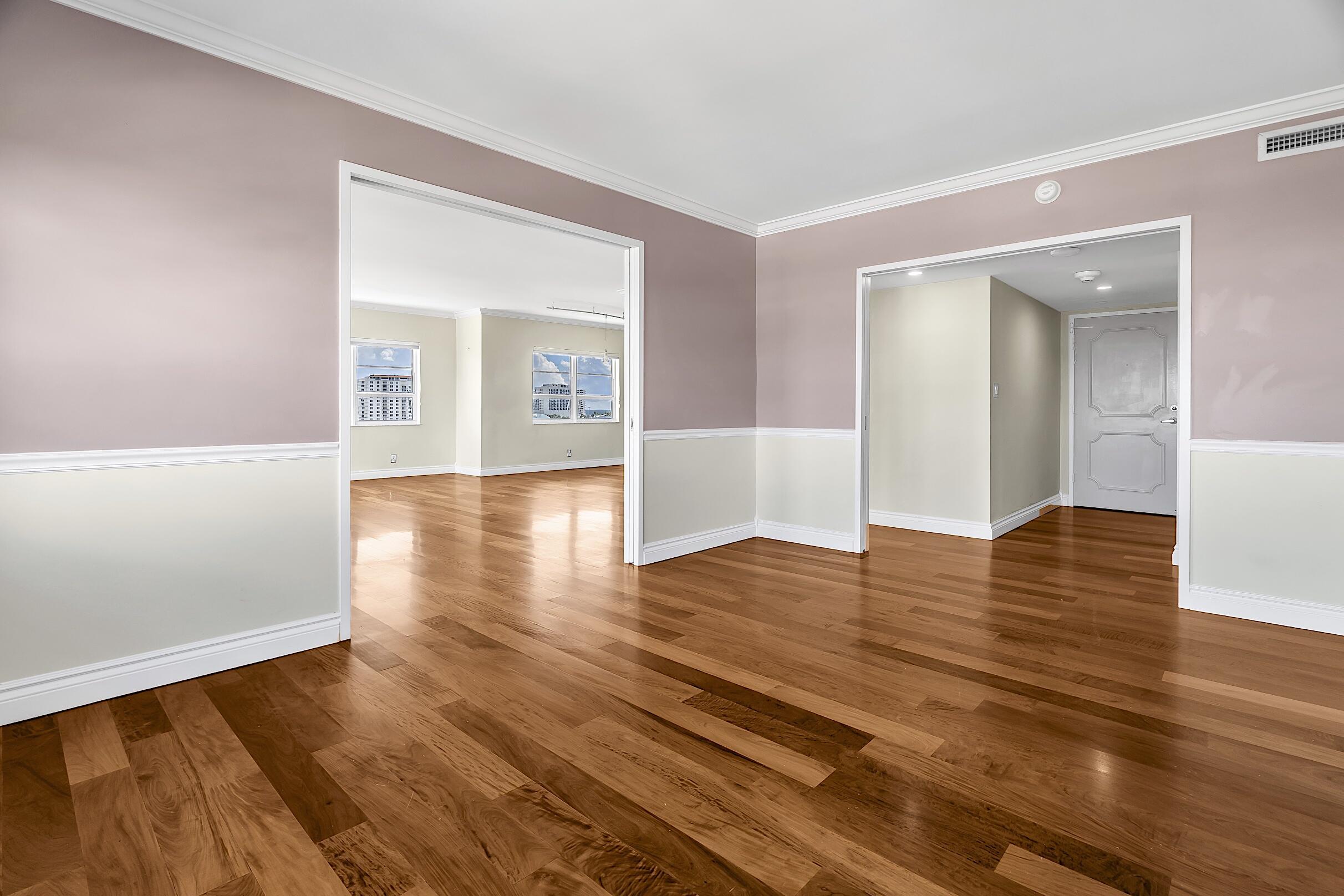 2500 East Las Olas Boulevard, Unit 802 Fort Lauderdale, FL 33301 - Photo 7 of 67 a view of an empty room with wooden floor and a window