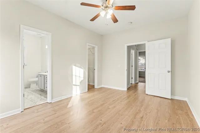 a view of an empty room and wooden floor