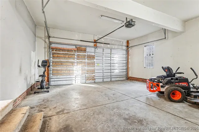 a view of a garage with storage and utility