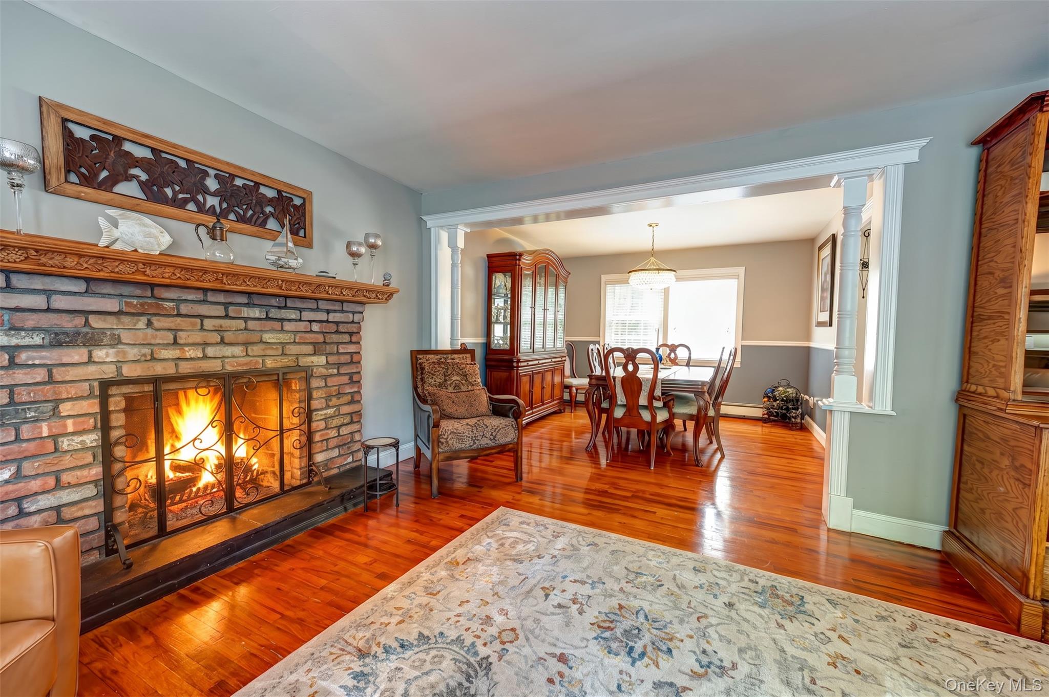 3 Thompson Hill Road St. James, NY 11780 - Photo 4 of 34 a living room with furniture and a fireplace