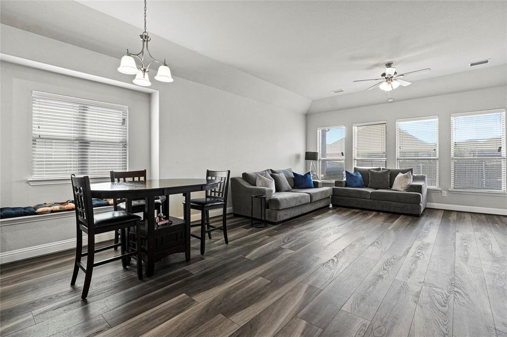 105 Melody Way Red Oak, TX 75154 - Photo 13 of 27 a living room with furniture and a chandelier