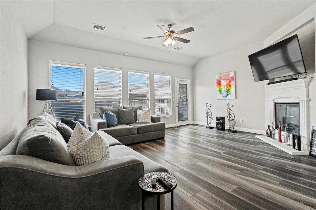 105 Melody Way Red Oak, TX 75154 - Photo 14 of 27 a living room with furniture fireplace and flat screen tv