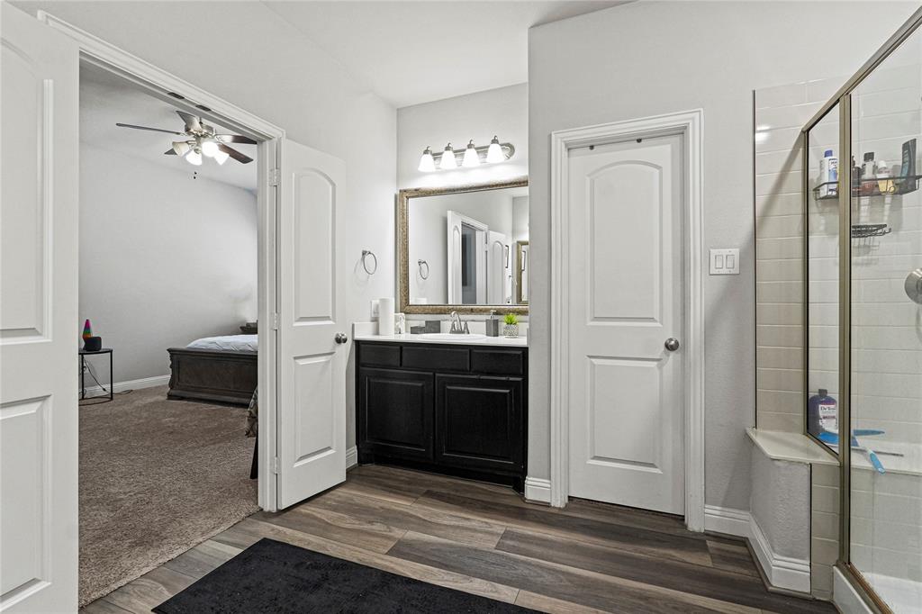 105 Melody Way Red Oak, TX 75154 - Photo 20 of 27 a bathroom with a double vanity sink and mirror