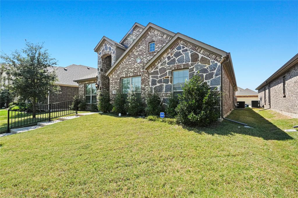 105 Melody Way Red Oak, TX 75154 - Photo 2 of 27 a view of a house with a yard and a porch