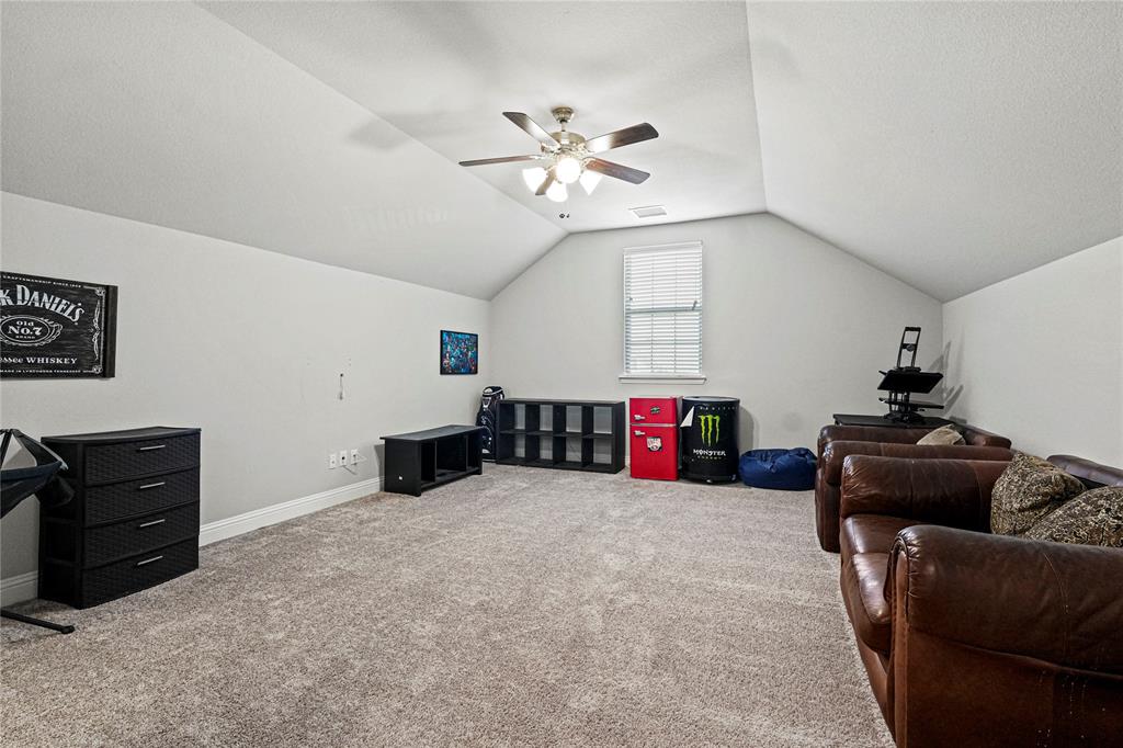 105 Melody Way Red Oak, TX 75154 - Photo 22 of 27 a living room with furniture and a ceiling fan
