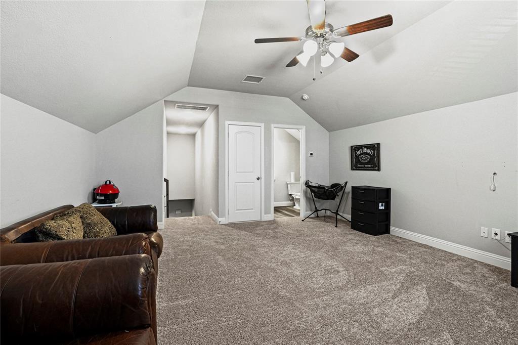 105 Melody Way Red Oak, TX 75154 - Photo 23 of 27 a living room with furniture and a chandelier