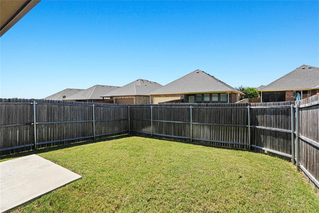 105 Melody Way Red Oak, TX 75154 - Photo 25 of 27 a view of a backyard with a small pool and wooden fence