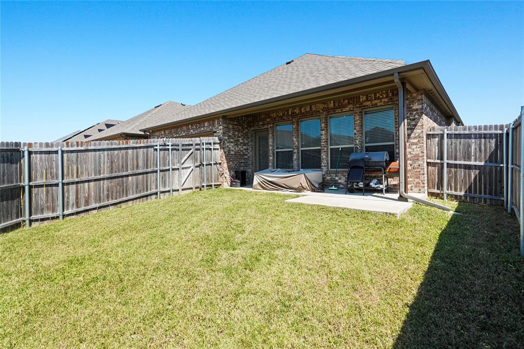 105 Melody Way Red Oak, TX 75154 - Photo 26 of 27 a view of a house with a backyard and a patio