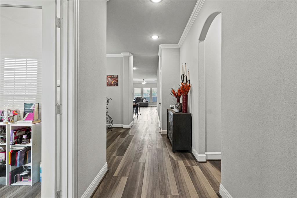 105 Melody Way Red Oak, TX 75154 - Photo 3 of 27 a view of a hallway with wooden floor and stairs