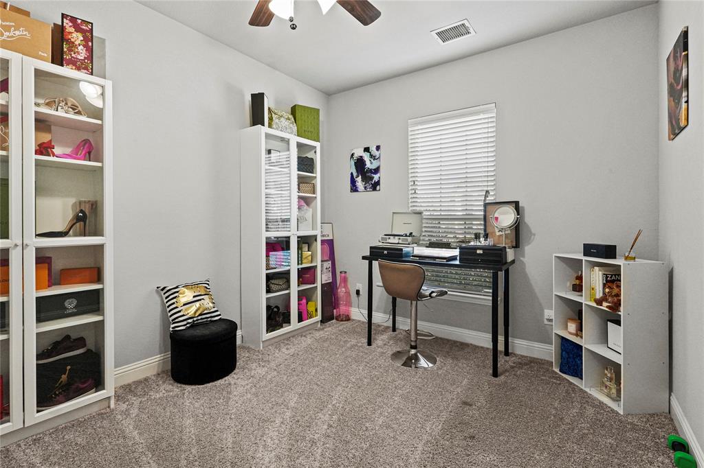 105 Melody Way Red Oak, TX 75154 - Photo 8 of 27 a view of a workspace with furniture and toys