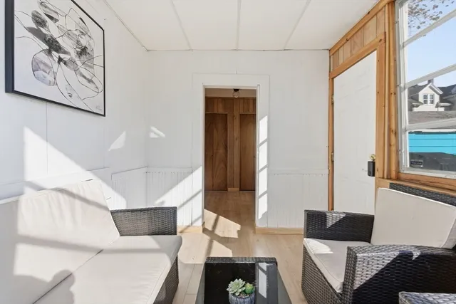 a living room with furniture and a window