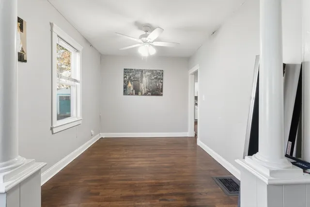 a view of an entryway with wooden floor and a window