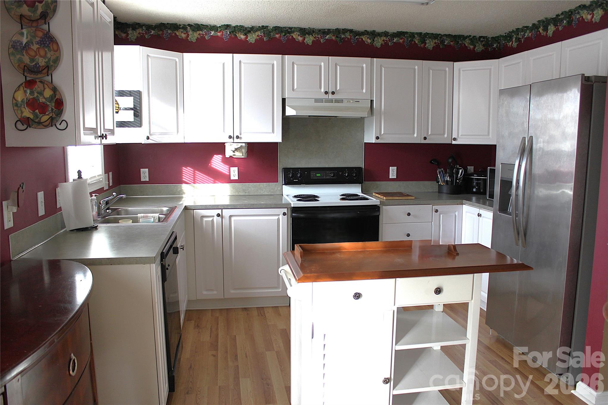711 Braemore Court Northwest Conover, NC 28613 - Photo 11 of 25 a kitchen with stainless steel appliances granite countertop a sink stove and refrigerator