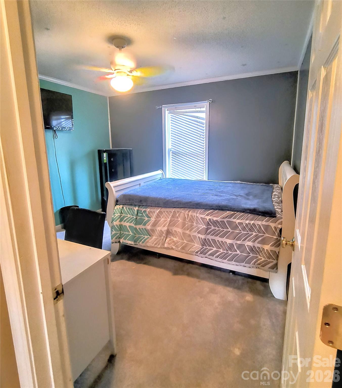 711 Braemore Court Northwest Conover, NC 28613 - Photo 19 of 25 a bedroom with a bed and a window