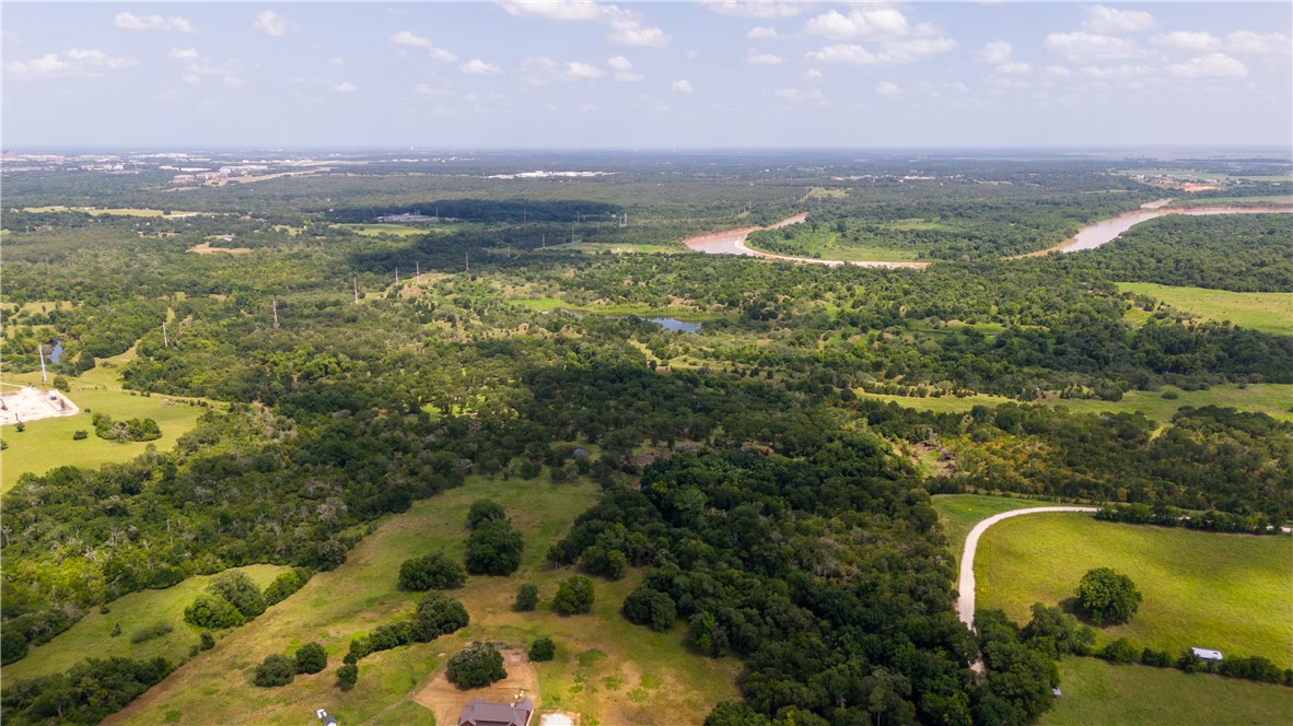 0 Leonard Road Bryan, TX 77807 - Photo 5 of 24 Aerial overview of property's location with a heavily wooded area