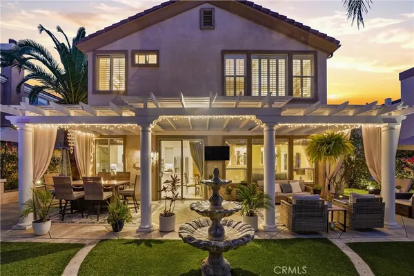 a front view of a house with outdoor seating