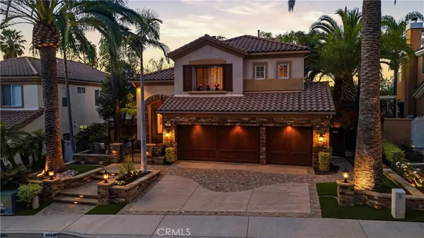 a front view of a house with yard