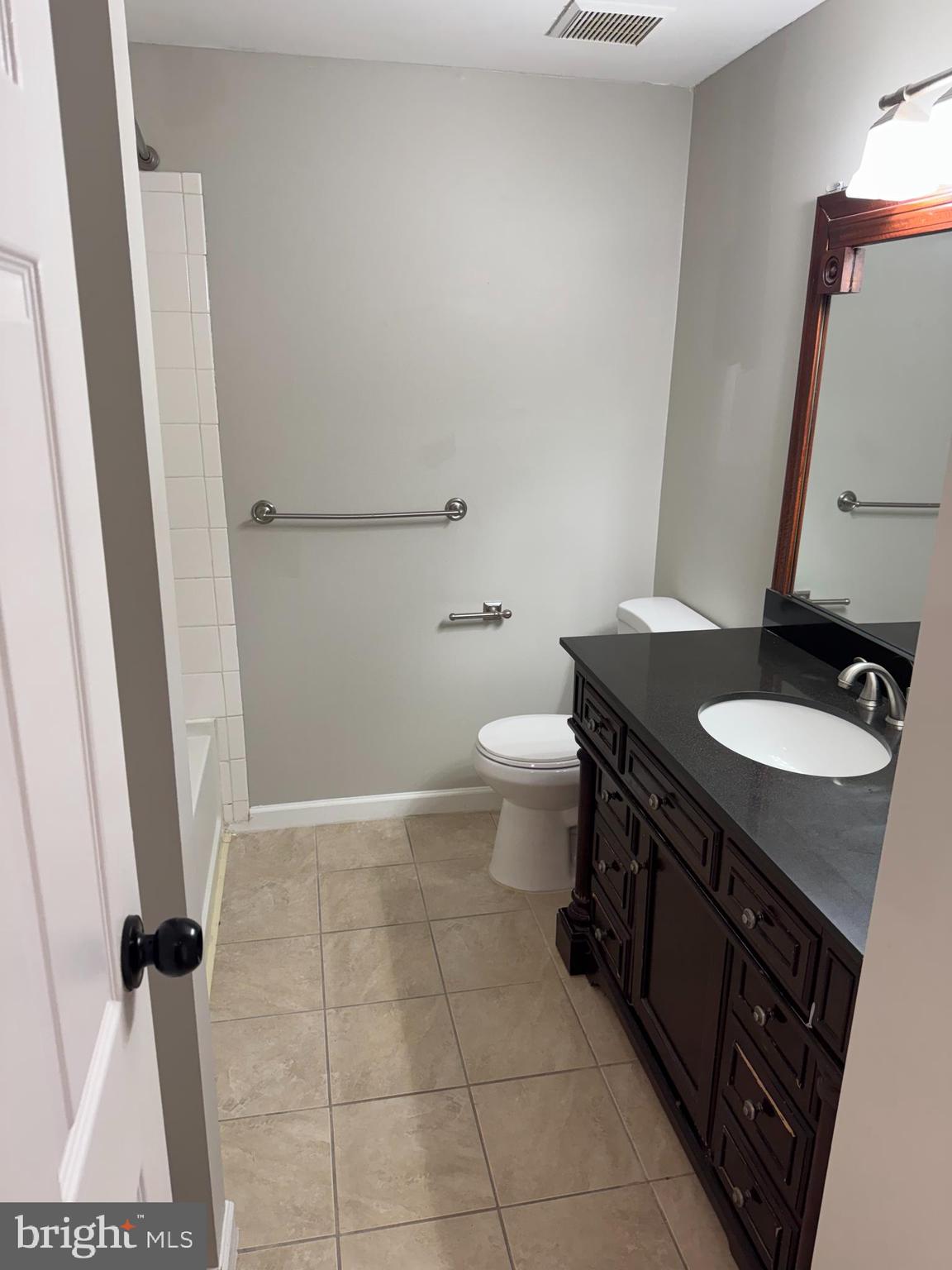 6366 Bonham Place Centreville, VA 20121 - Photo 15 of 18 a bathroom with a sink and a toilet