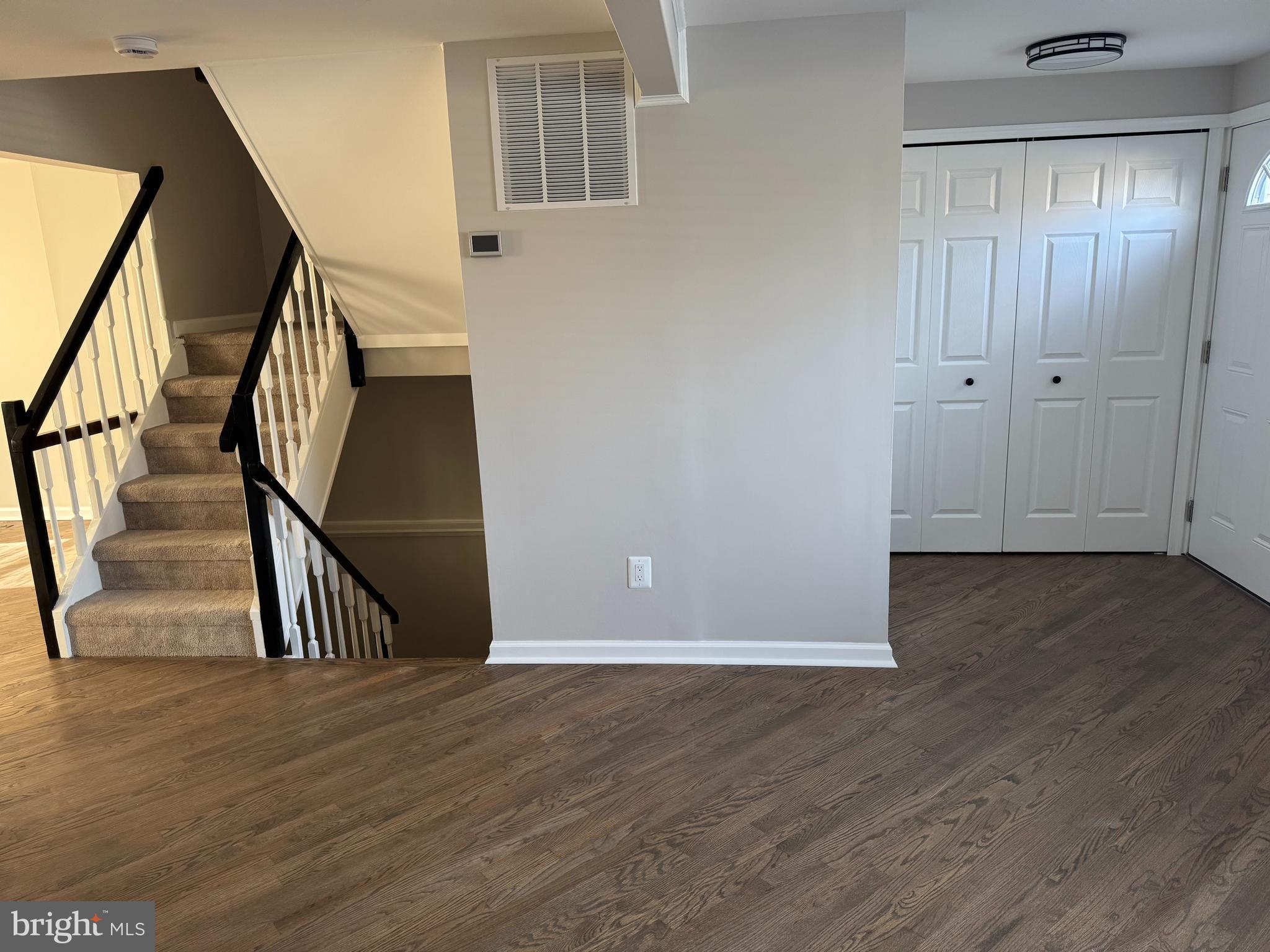 6366 Bonham Place Centreville, VA 20121 - Photo 7 of 18 a view of an entryway with wooden floor