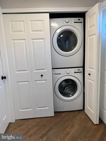 a view of a hallway with washer and dryer