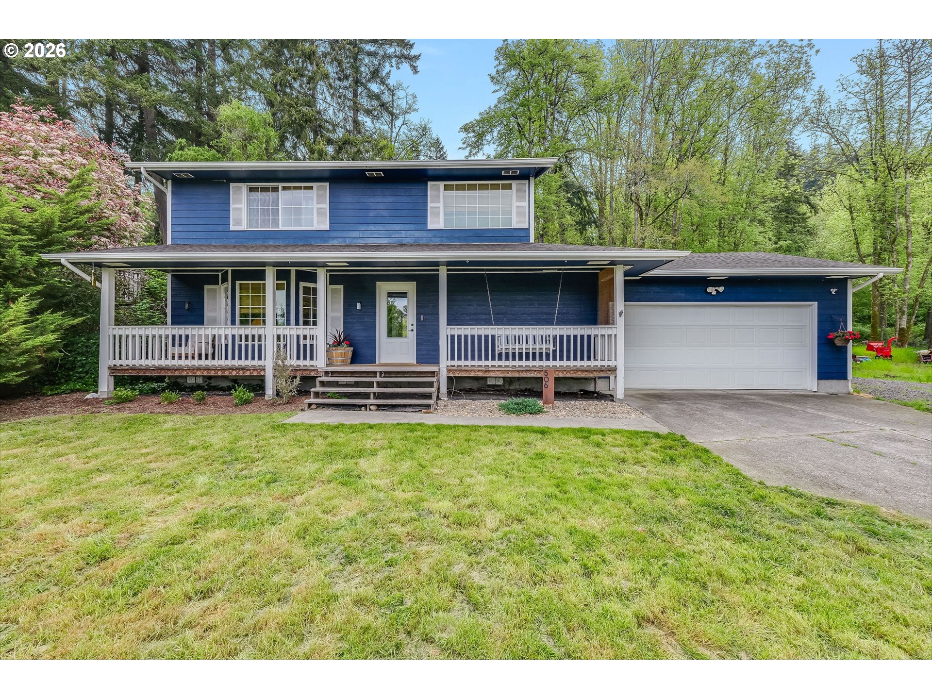 506 Haussler Road Kelso, WA 98626 - Photo 1 of 36 a view of a house with backyard porch and garden