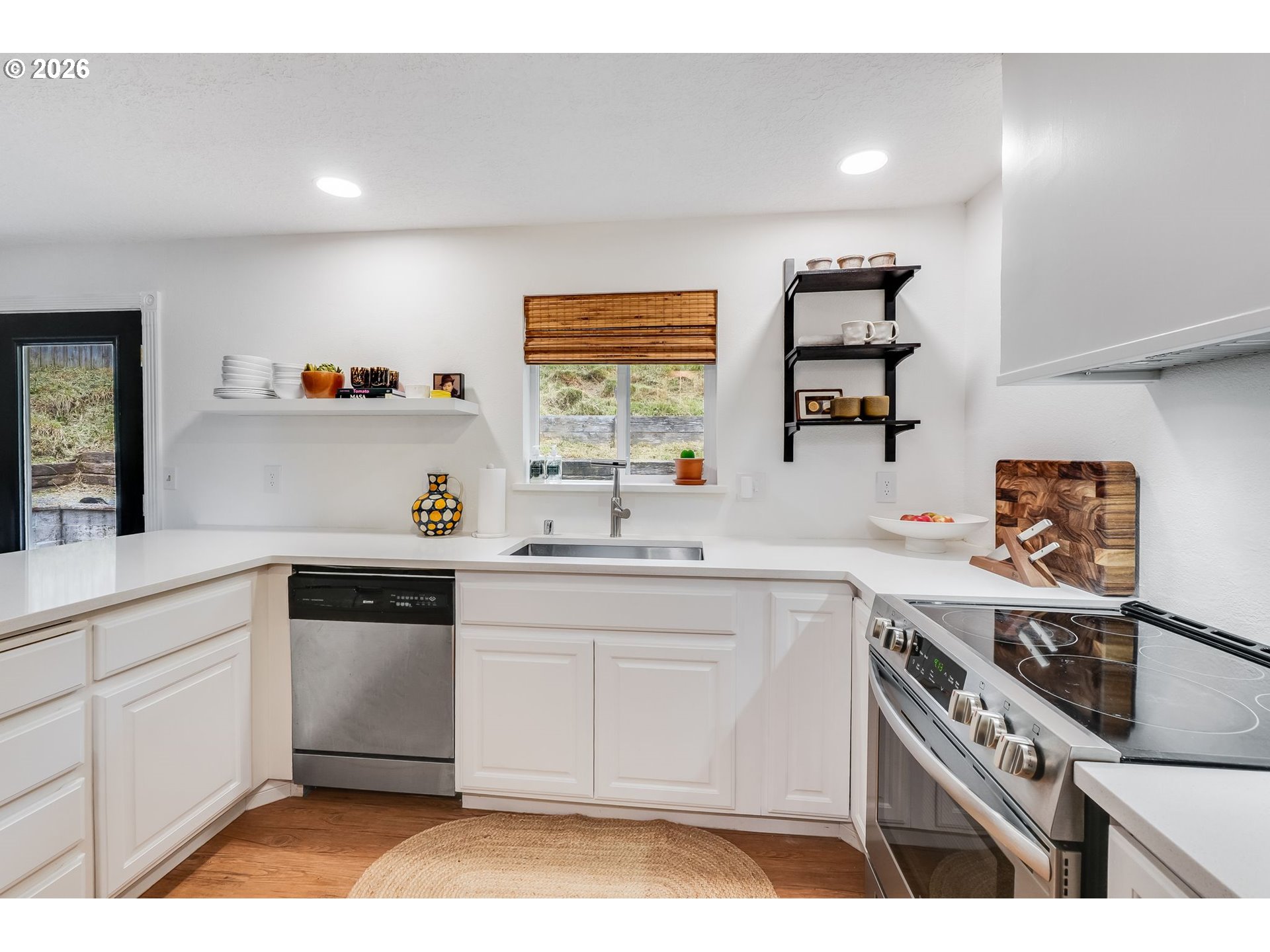 506 Haussler Road Kelso, WA 98626 - Photo 11 of 36 a kitchen with a sink cabinets and window