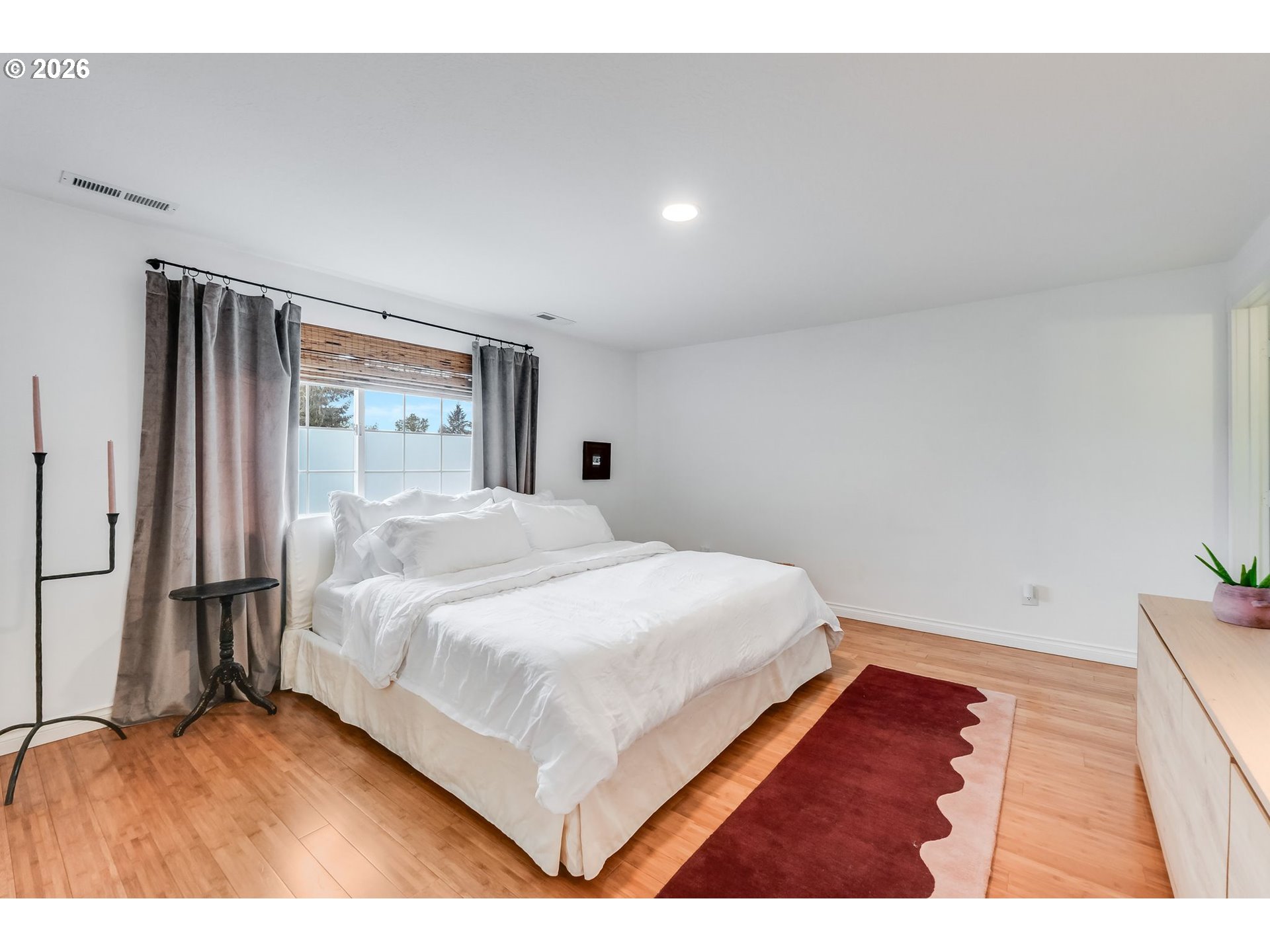506 Haussler Road Kelso, WA 98626 - Photo 13 of 36 a bedroom with a bed and a large window