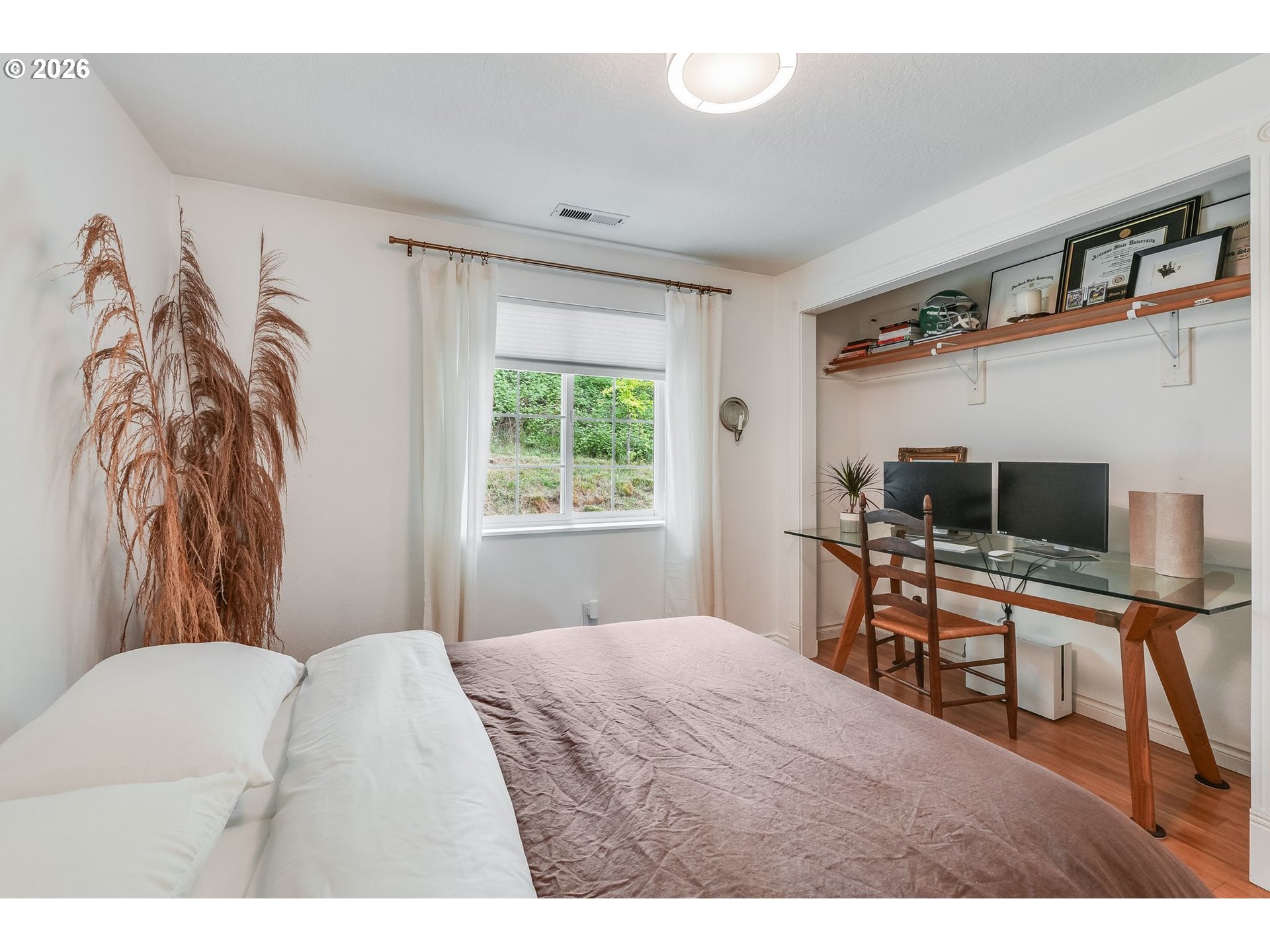 506 Haussler Road Kelso, WA 98626 - Photo 20 of 36 a bedroom with a bed and a flat screen tv