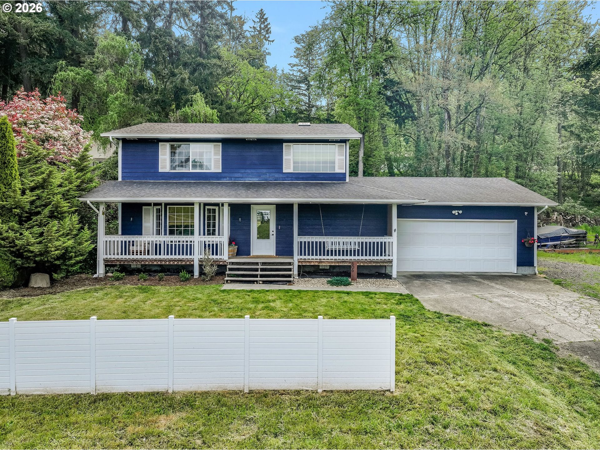 506 Haussler Road Kelso, WA 98626 - Photo 27 of 36 a front view of a house with a yard and trees
