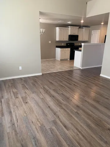 a view of kitchen with kitchen island microwave and stove