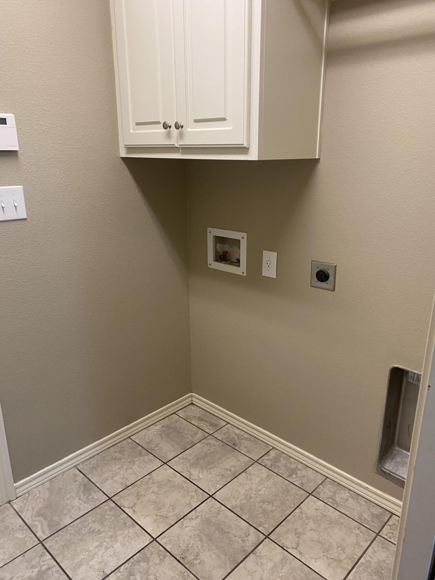 8707 11th Street Lubbock, TX 79416 - Photo 8 of 9 a view of cabinets