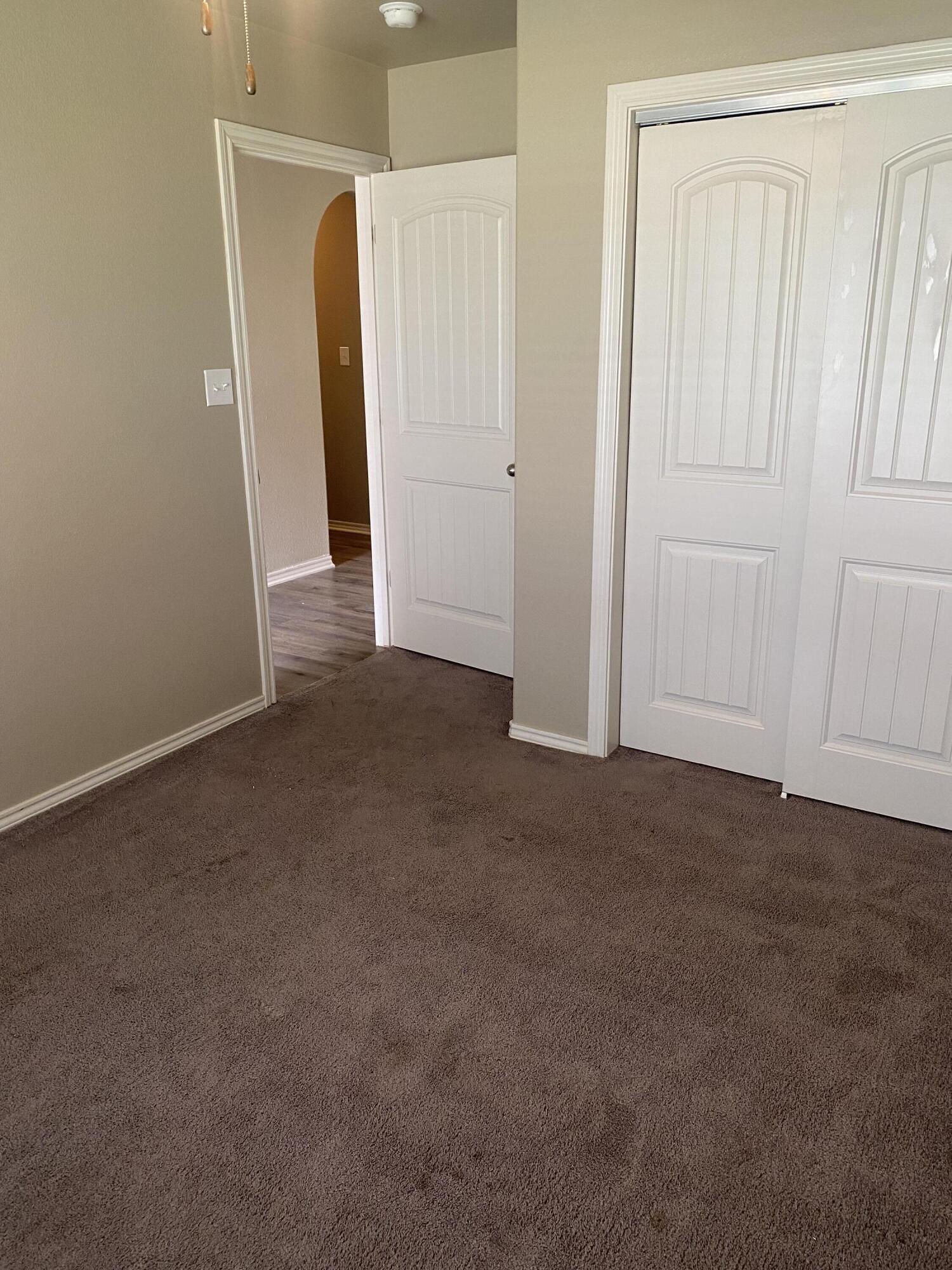 8707 11th Street Lubbock, TX 79416 - Photo 9 of 9 a view of an empty room