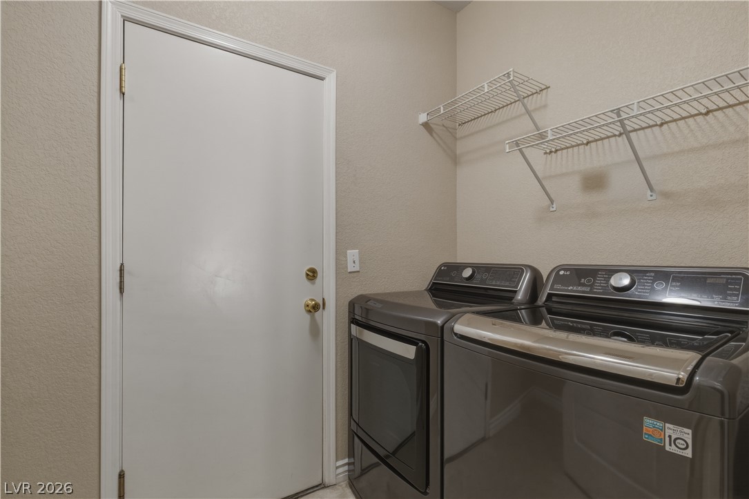 29 Olive Tree Henderson, NV 89074 - Photo 24 of 60 This dedicated laundry area offers practical convenience for daily chores.