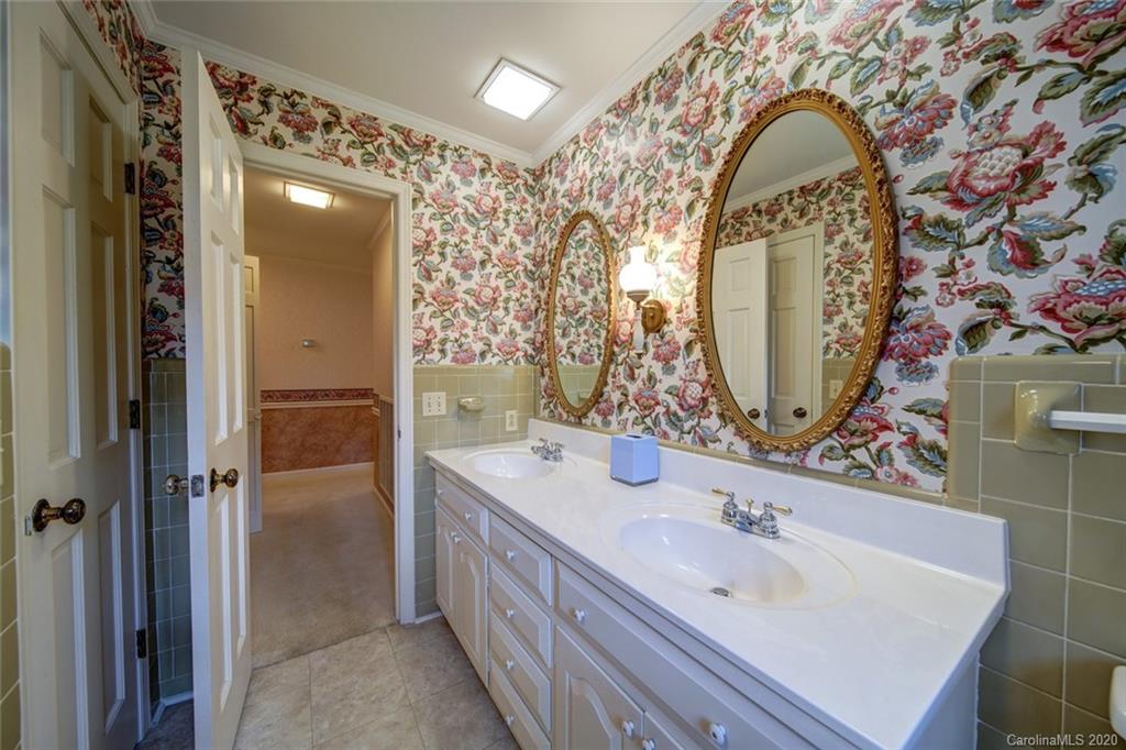 1415 Melchor Road Albemarle, NC 28001 - Photo 21 of 47 a bathroom with a sink and a mirror