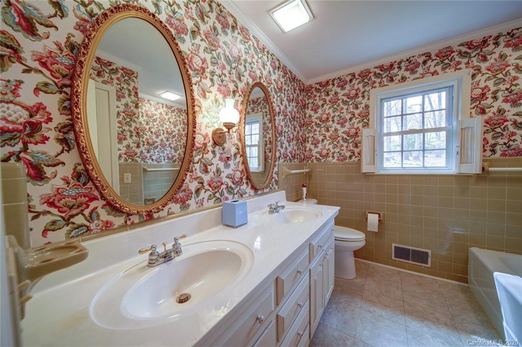 1415 Melchor Road Albemarle, NC 28001 - Photo 22 of 47 a bathroom with a sink and a mirror