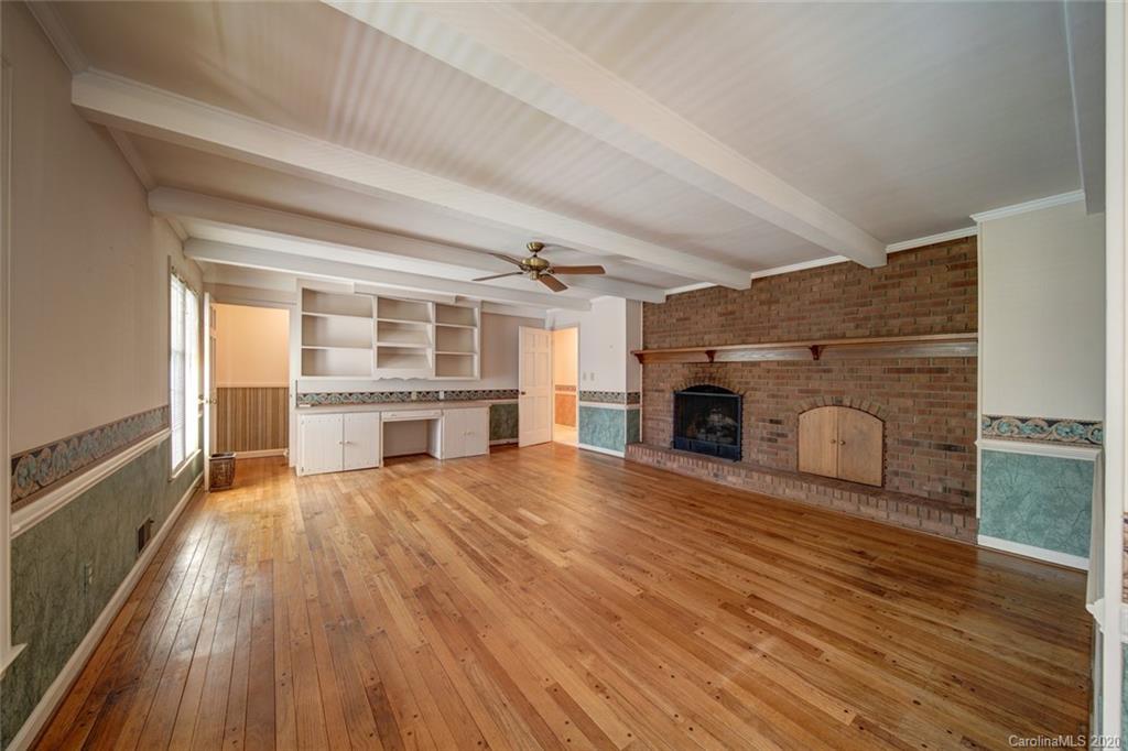 1415 Melchor Road Albemarle, NC 28001 - Photo 26 of 47 a view of empty room with wooden floor and fireplace