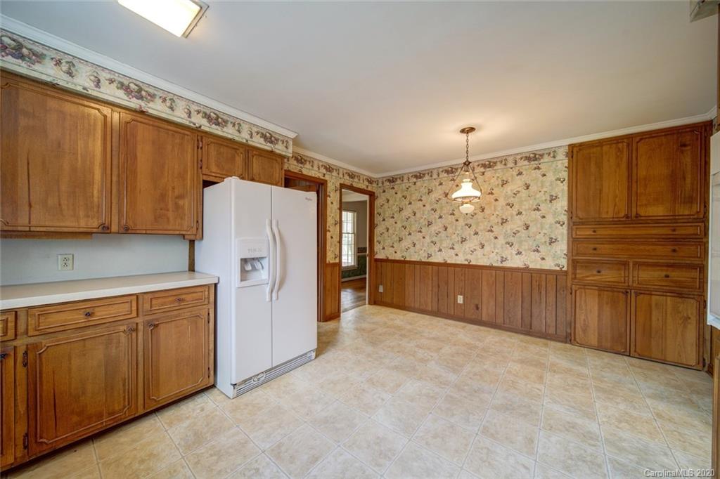1415 Melchor Road Albemarle, NC 28001 - Photo 27 of 47 a view of a kitchen with refrigerator cabinet and wooden floor