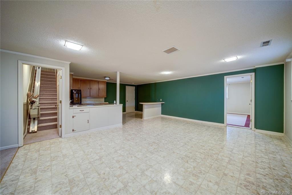 1415 Melchor Road Albemarle, NC 28001 - Photo 33 of 47 a view of a big room with wooden cabinet and a large window