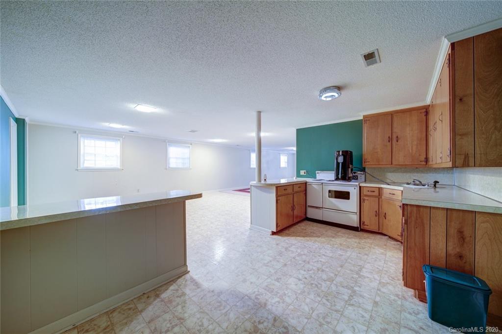 1415 Melchor Road Albemarle, NC 28001 - Photo 38 of 47 a large white kitchen with a large window