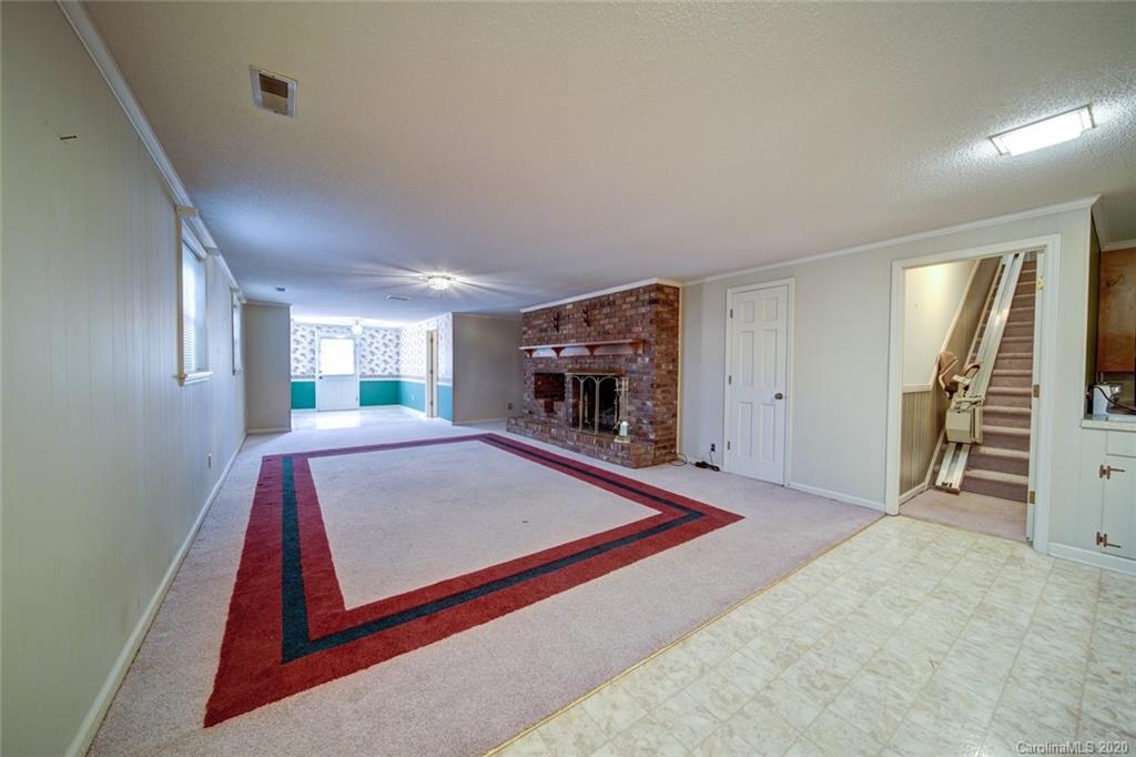 1415 Melchor Road Albemarle, NC 28001 - Photo 40 of 47 a living room with furniture and a flat screen tv